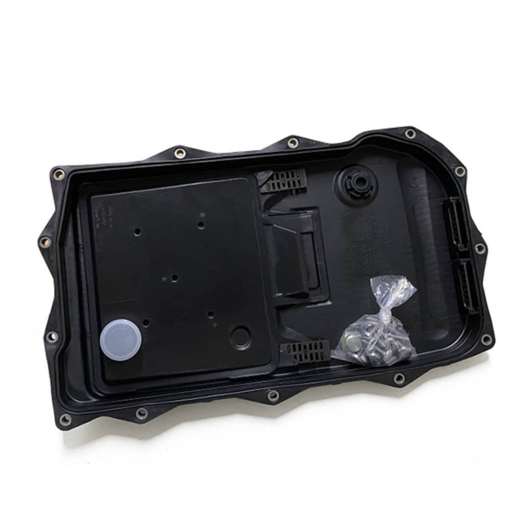 Black automatic transmission oil pan with open underside showing internal filter parts