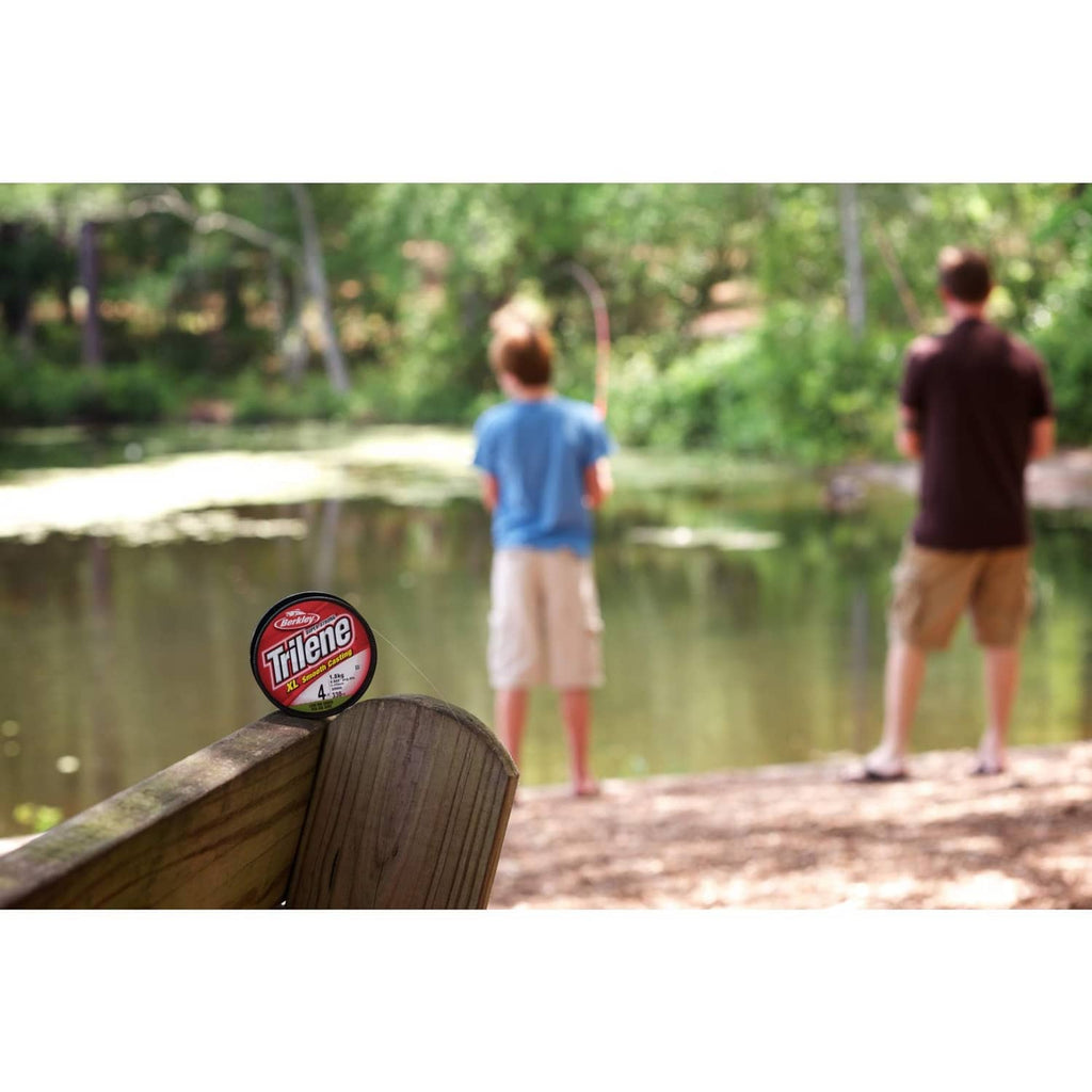 Berkley Trilene XL fishing line spool on dock railing, red label