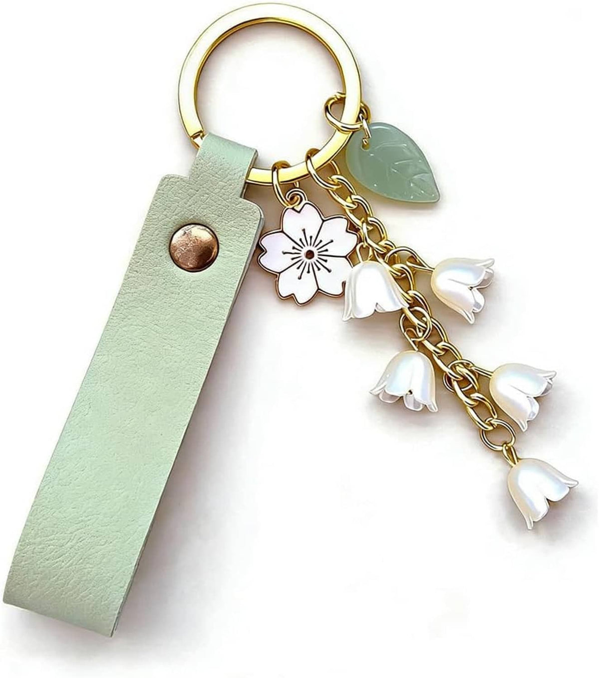 Mint green leather keychain with gold ring, green leaf charm, and white flower tassels