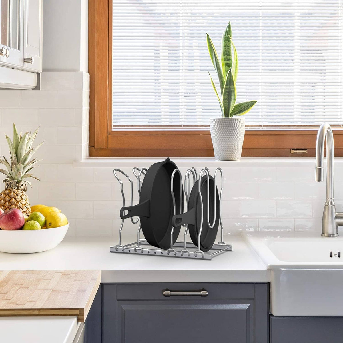 Under-sink style cookware organizer with black pan rack and chrome standing frame