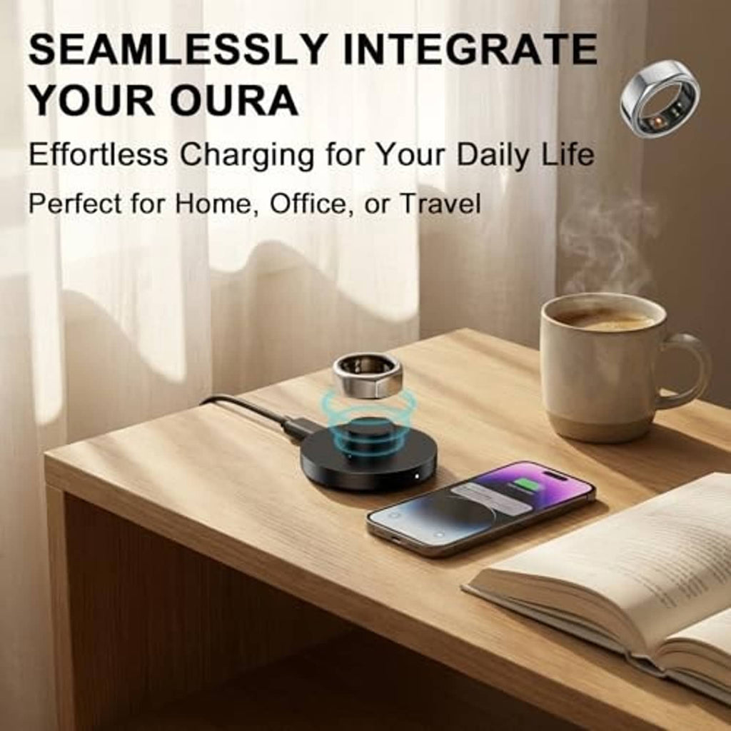 Black Oura Ring charging dock on tabletop with ring cradle and cable