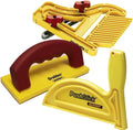Woodworking safety tool set with yellow feather board, red push blocks, and push stick