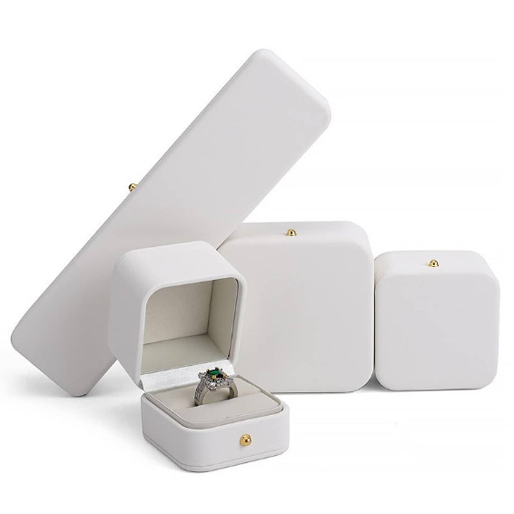 White jewelry gift boxes with open lid and small compartment for ring or necklace