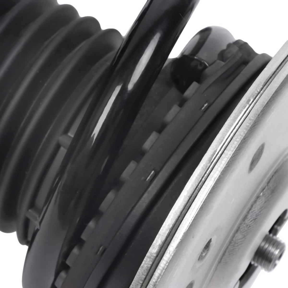 Front shock absorber strut spring and silver shock tube with black coil windings.