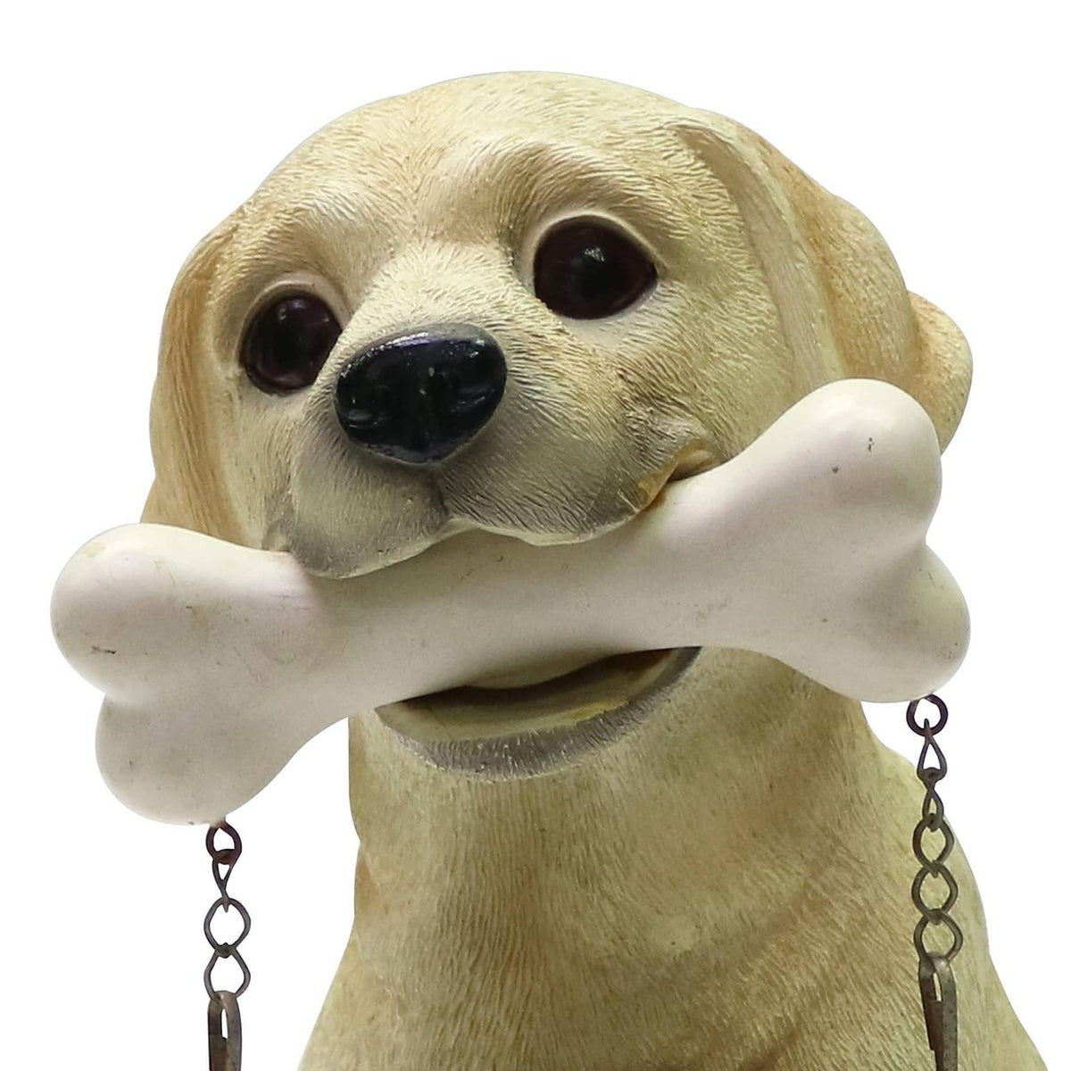 Tan Labrador puppy statue with white bone held in its mouth, hanging chains