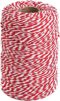 Red and white cotton twine spool with spiral winding and visible cardboard center