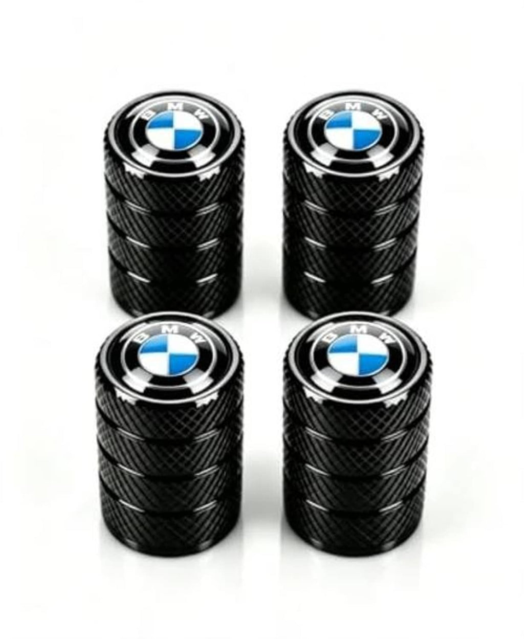 Four black tire valve stem caps with textured grip and BMW blue-and-white emblem