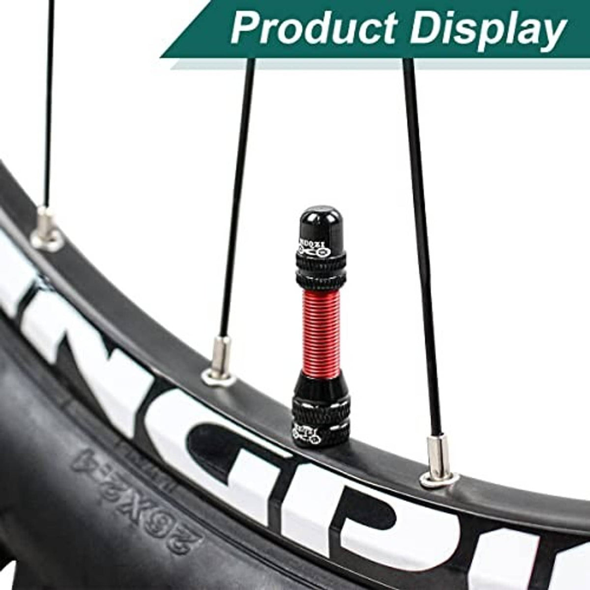 Tubeless valve stem mounted on bike wheel rim, red threaded core with black base