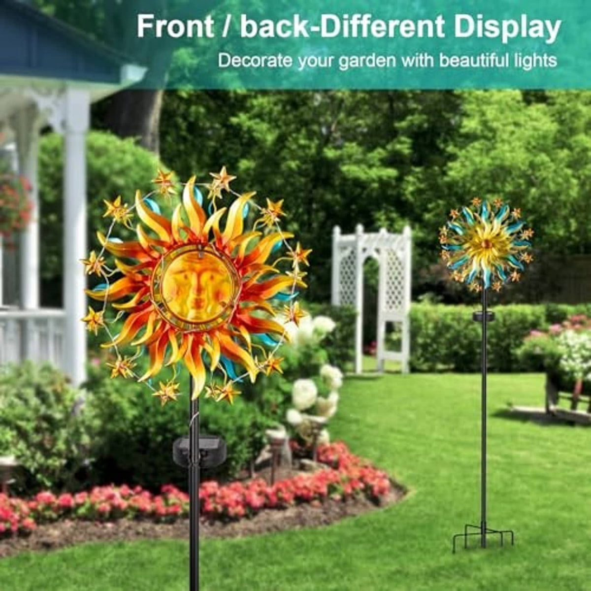 Single solar sun wind spinner with colorful rays on tall black stake in garden.