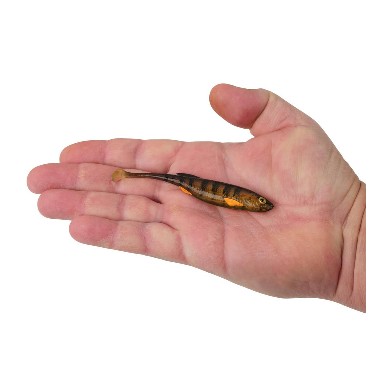 Soft plastic fishing bait on open palm, yellow-green with black stripes and orange