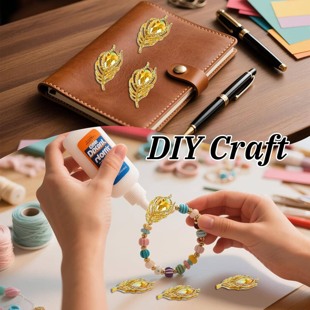 Gold rhinestone feather charms on brown leather notebook for DIY crafting