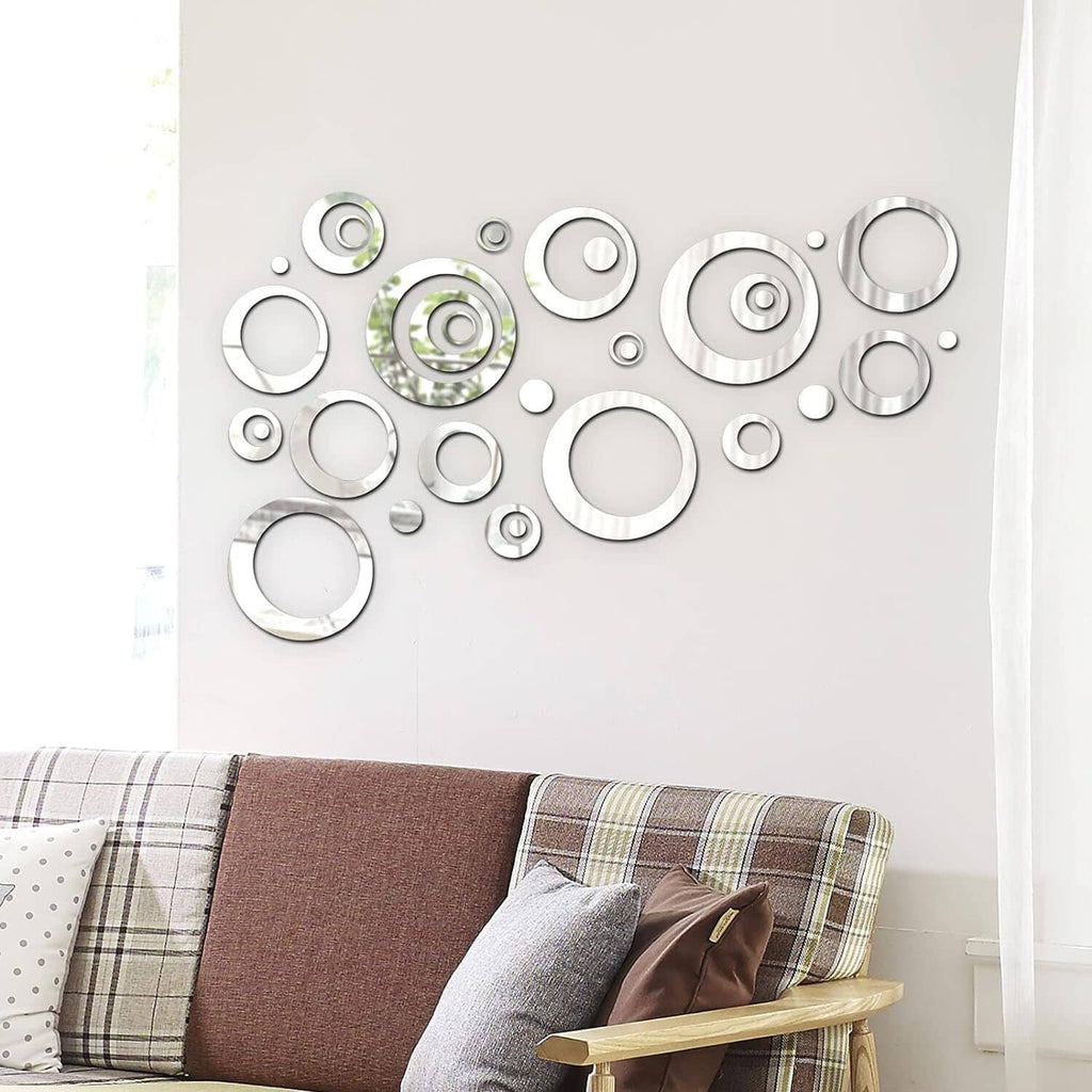 Set of reflective silver circular wall stickers arranged in mixed sizes