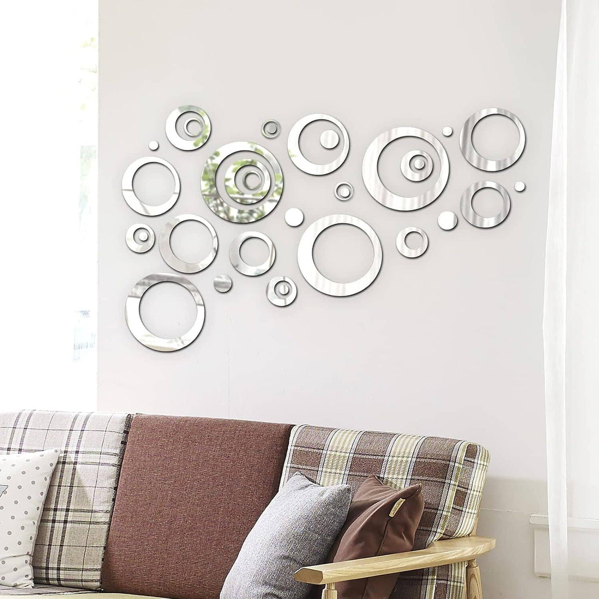 Set of reflective silver circular wall stickers arranged in mixed sizes