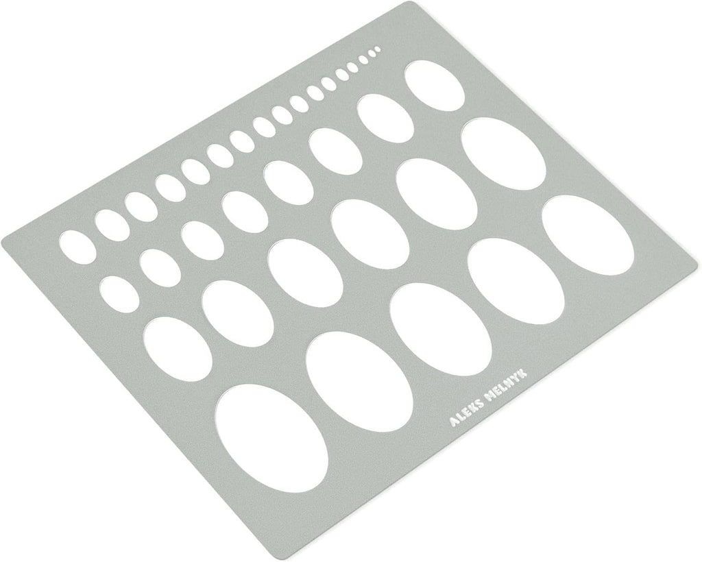 Geometric ellipse stencil template with oval cutouts on a gray metal sheet