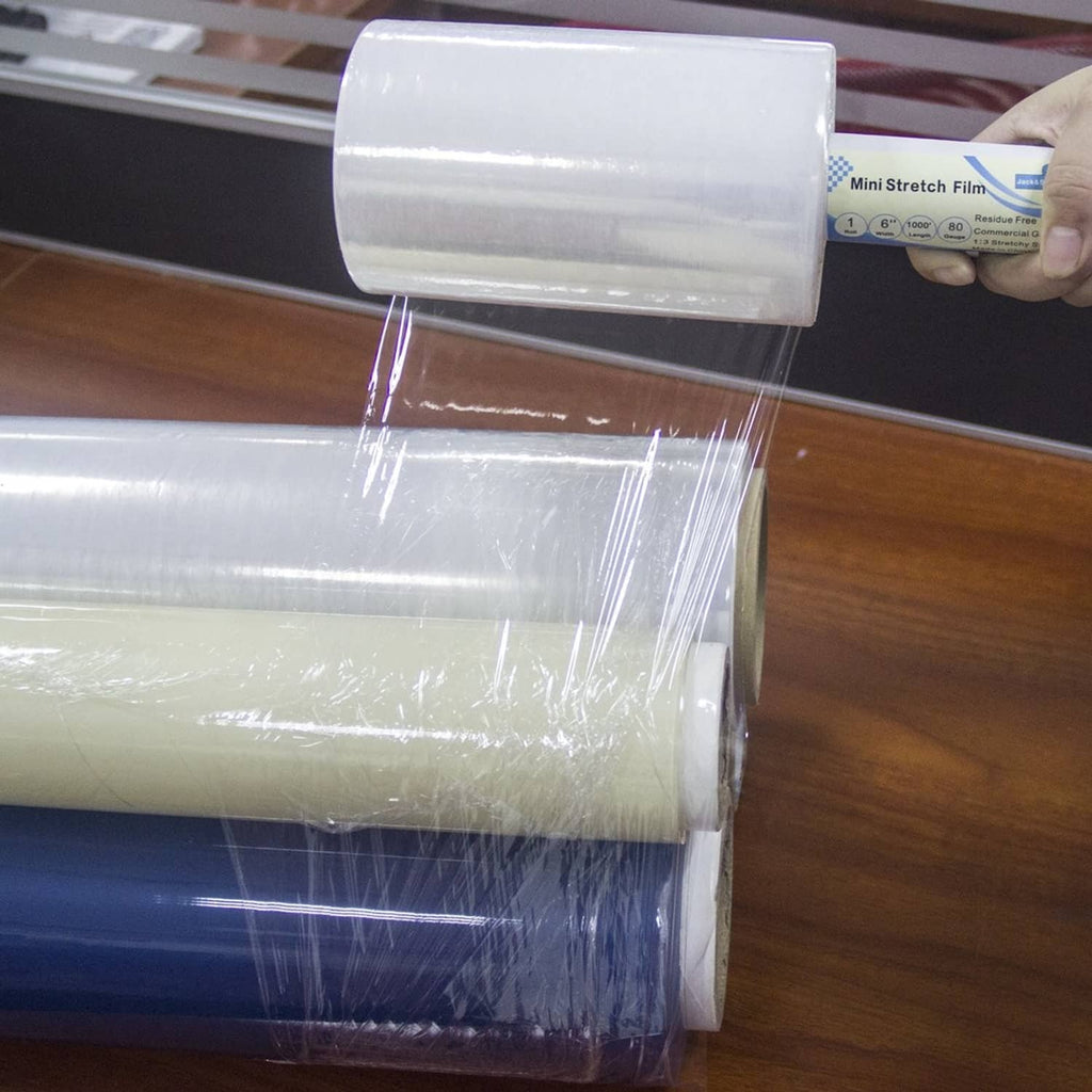 Transparent stretch wrap film pulled taut over stacked items