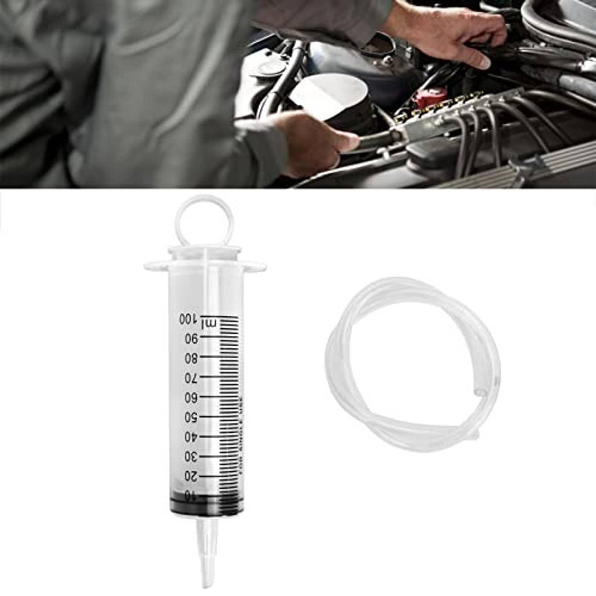 Brake bleed syringe and clear hose kit near motorcycle engine components