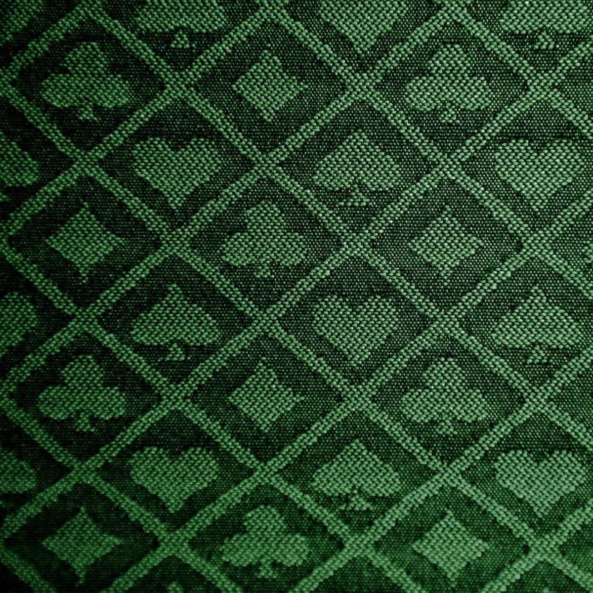 Green two-tone poker table speed cloth close-up with geometric diamond pattern