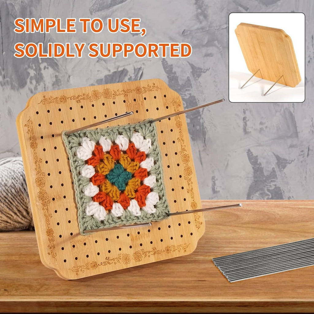 Light tan crochet blocking board with crocheted square and metal support pins