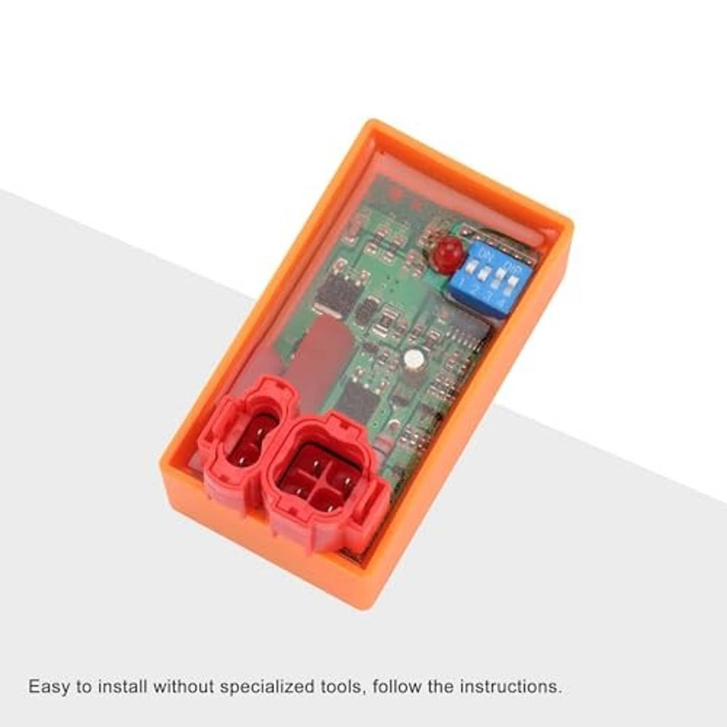 Orange CDI module angled view with red terminal sockets and green circuit board.