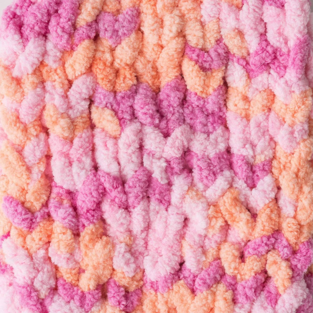 Peach and pink chenille yarn stripes with thick raised loop texture