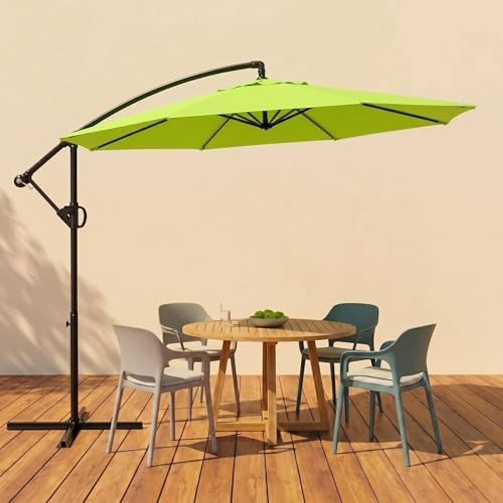 Green cantilever patio umbrella with offset black pole over outdoor table set