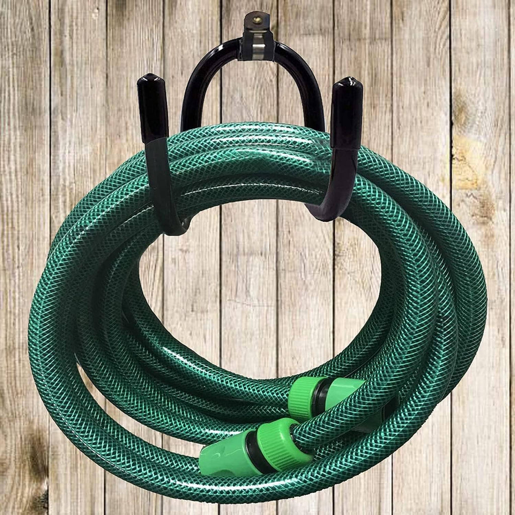 Black hose hanger with four posts holding dark teal garden hose coil