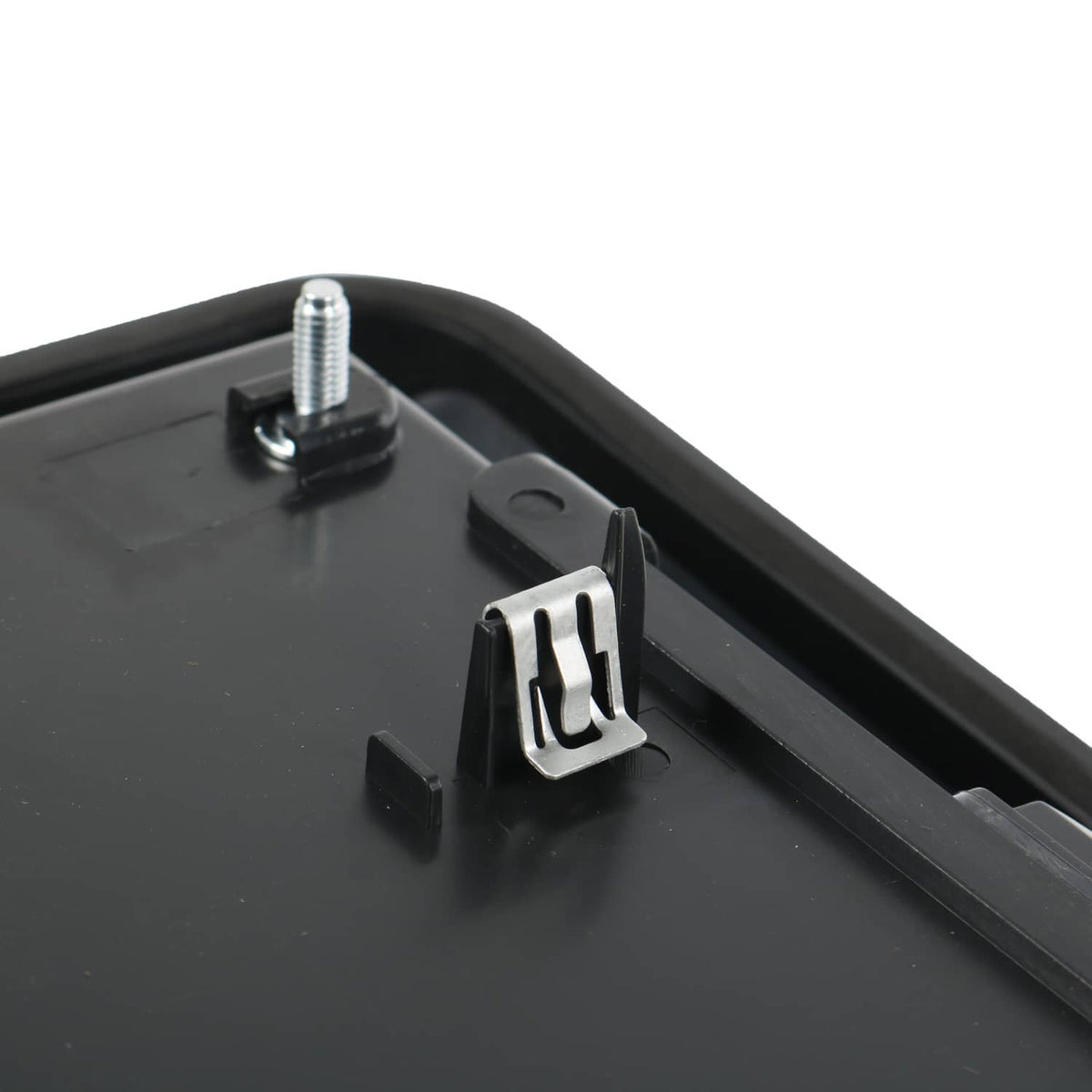 Rear tailgate license pocket with raised metal stud hardware, black plastic
