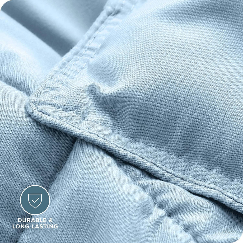 Light blue comforter fabric with visible stitching and quilted baffles