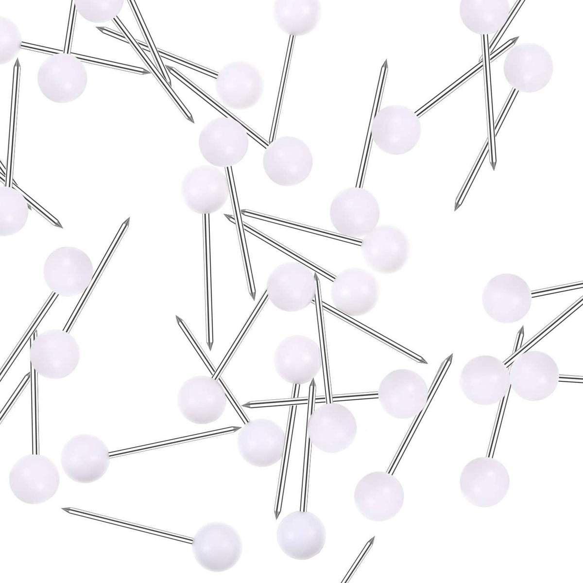 Cluster of white map push pins with round heads and silver metal needles