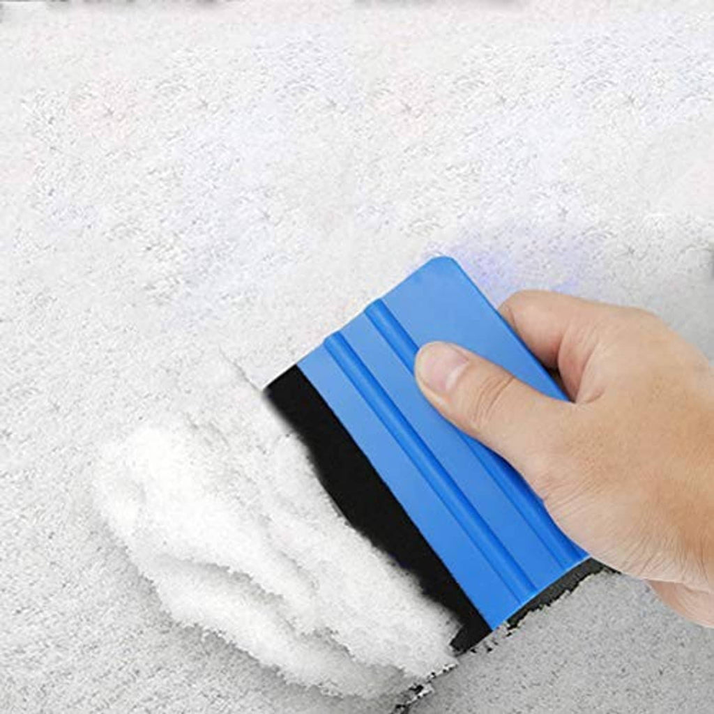 Blue felt edge squeegee with black edge, hand smoothing over a concrete surface