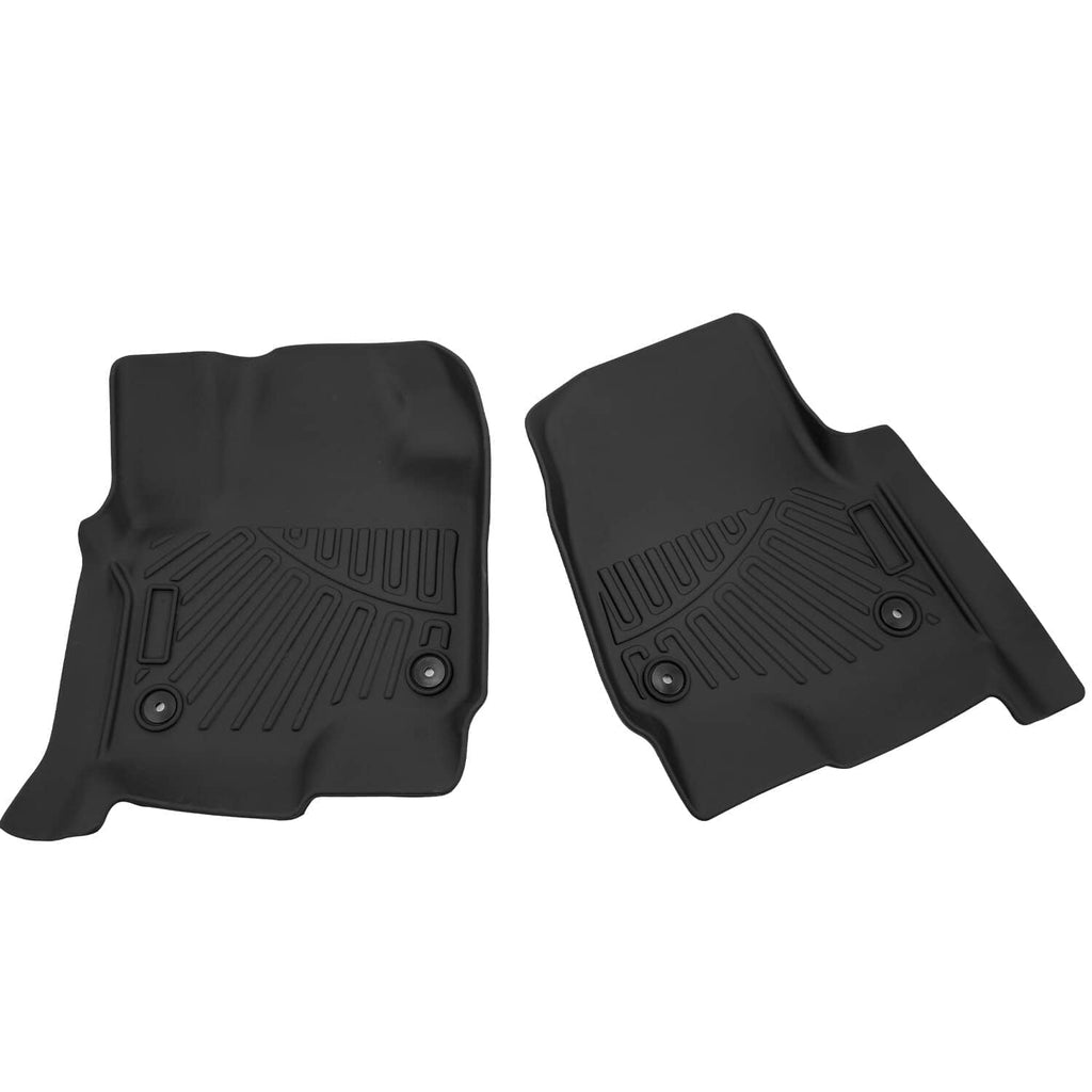 Black all-weather floor mats pair with molded tread texture and round grommet holes