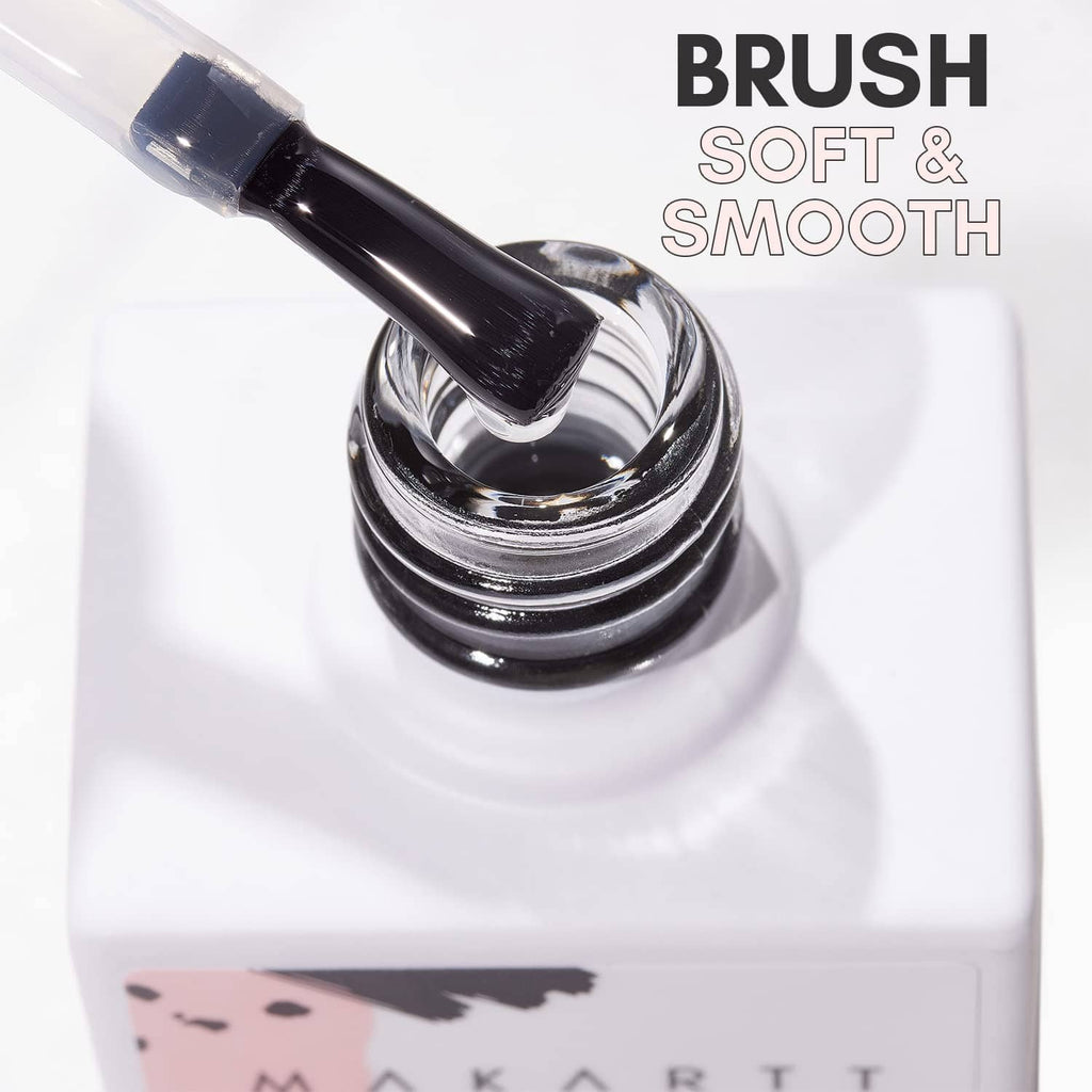 Nail foil glue gel brush over gel bottle, soft smooth application close-up