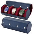 Dark blue leather watch roll travel case with three red velvet watch slots and silver snaps
