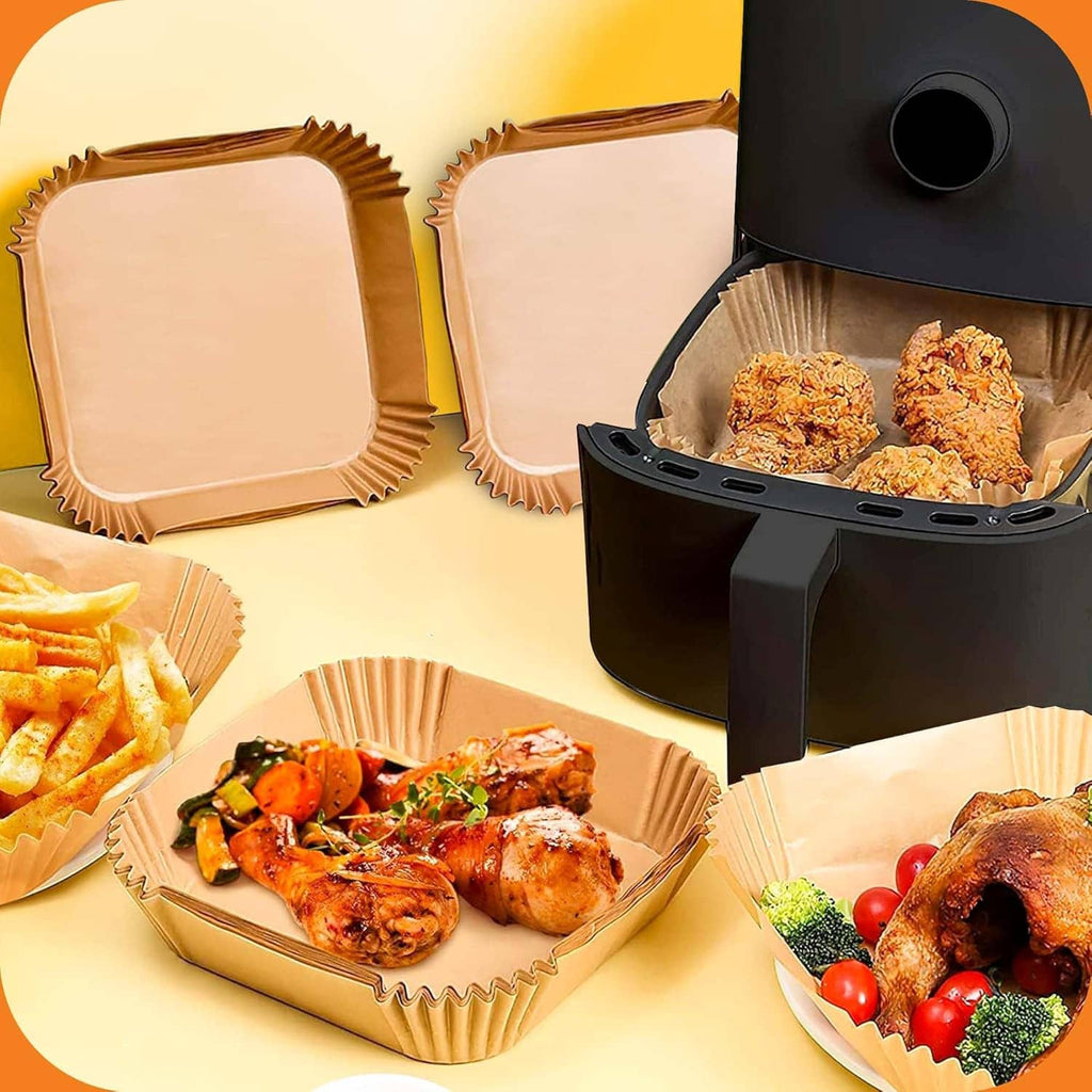 Air fryer paper liners arranged with prepared food in square trays