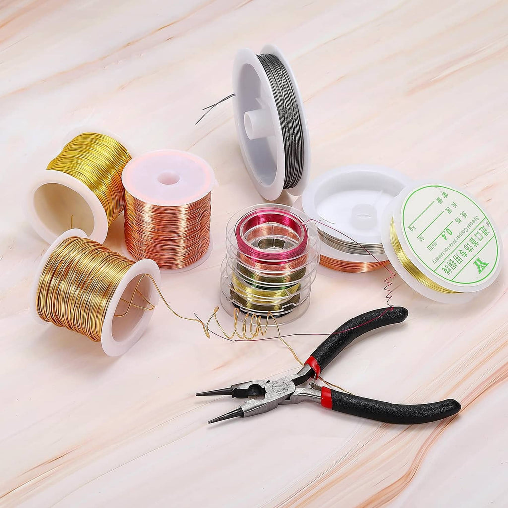 Copper jewelry wire spools in mixed colors with metal pliers for crafting