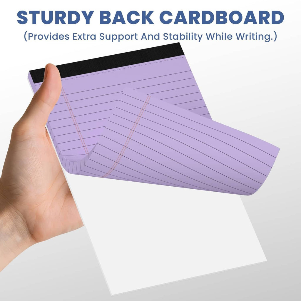 Purple small note pad held in hand with graph-style printed lines and sturdy backing