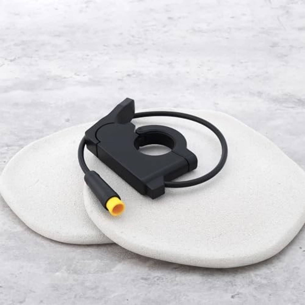 Electric bike thumb throttle with black housing and yellow-ended 3-pin plug on cable