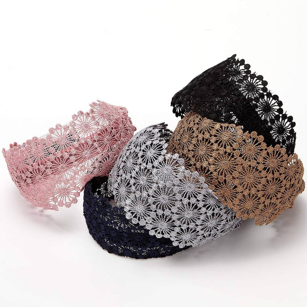 Assorted lace headbands in pink, black, white, tan, and navy stacked together