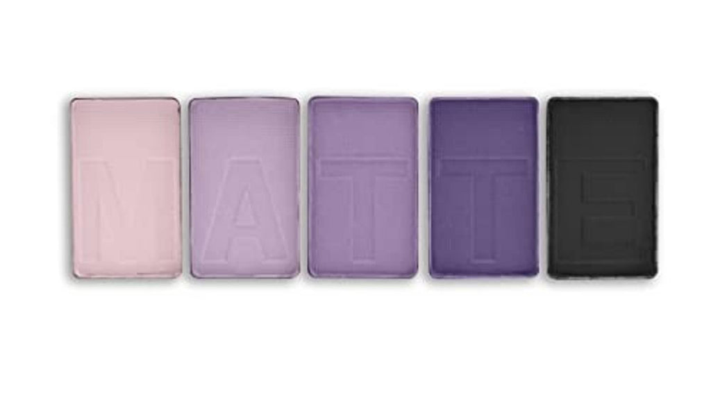 Five matte eyeshadow pans in soft pink, lavender, mauve, purple and dark tones