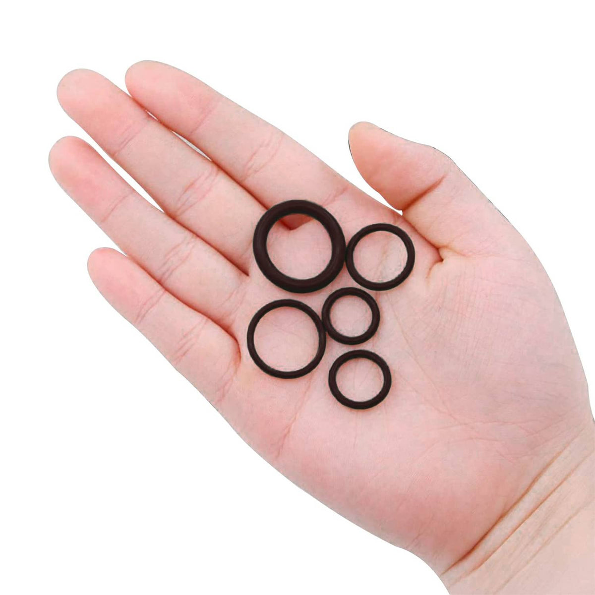 Black rubber O-rings in an open palm, round seal rings