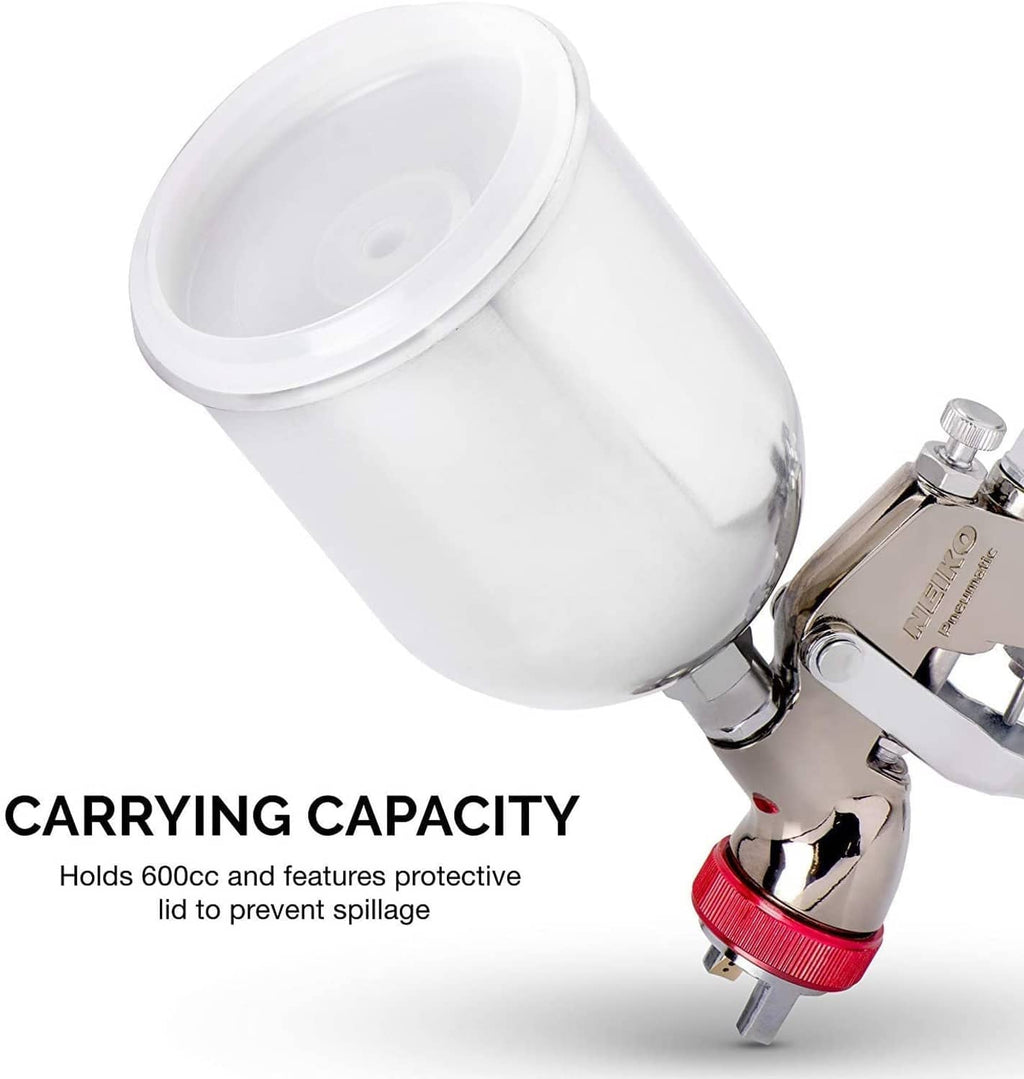 White gravity feed paint cup and red control ring on air spray gun body