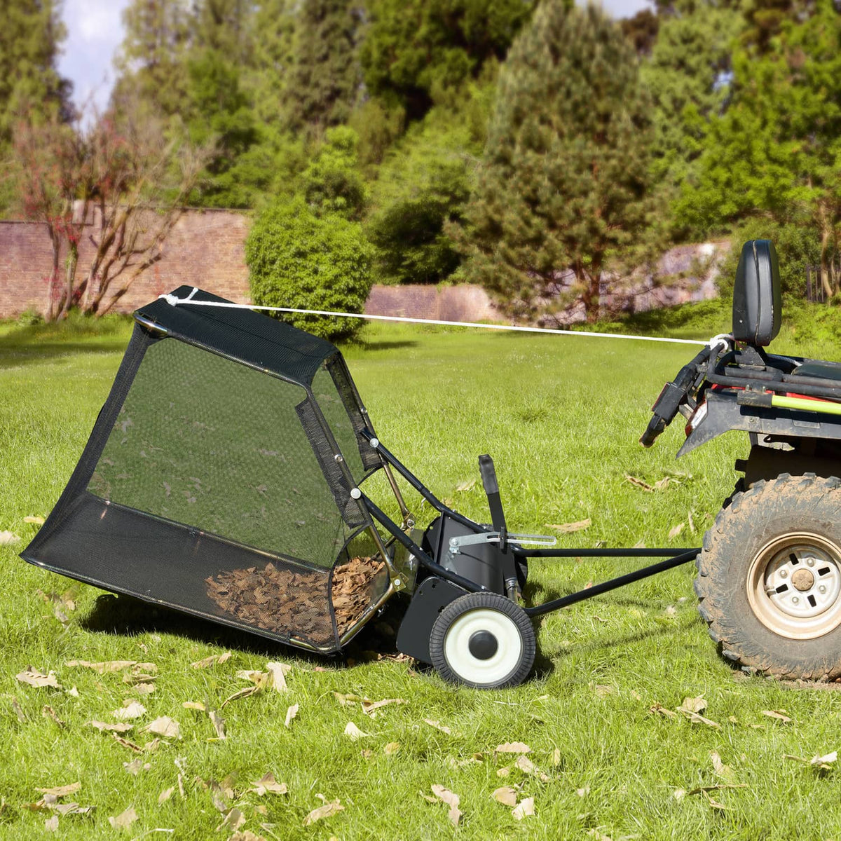 Tow-behind lawn leaf sweeper with black mesh hopper and adjustable frame