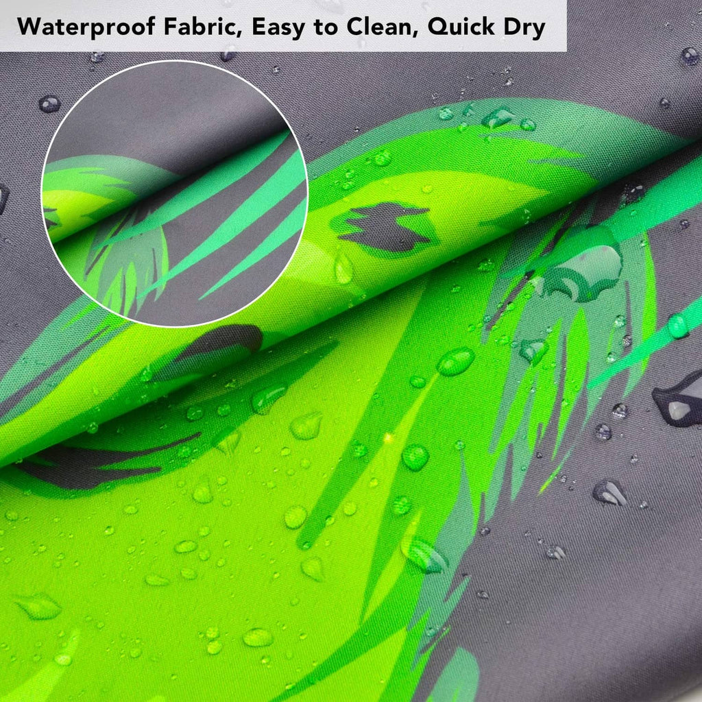 Waterproof dinosaur haircut cape fabric close-up, green dinosaur print with water droplets