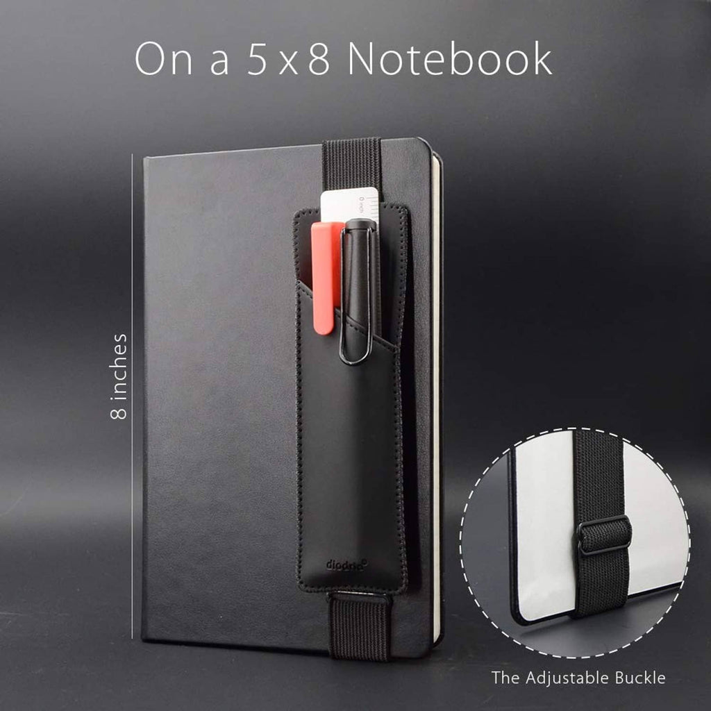 Black pen holder sleeve with adjustable buckle, holding a pen inside the elastic pocket.