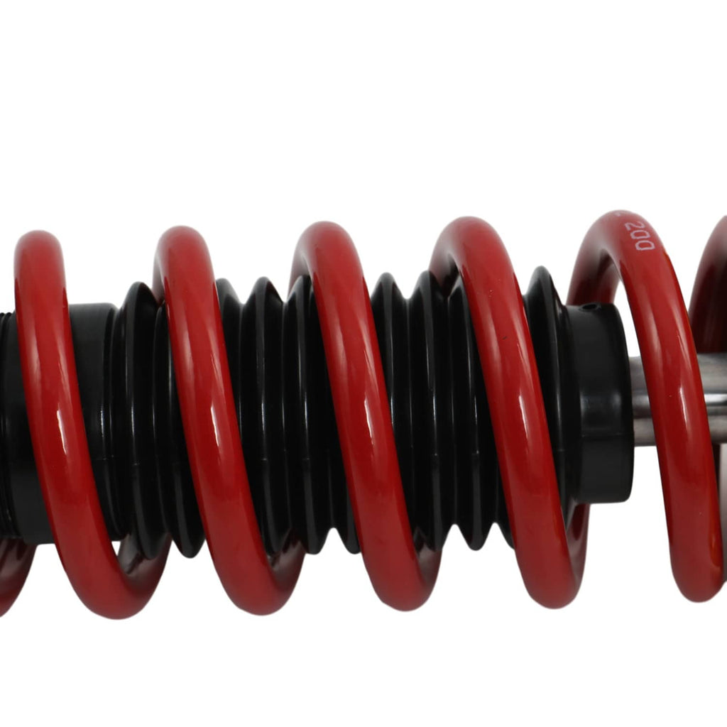 Coilover coil spring with red turns and black spring seat housing