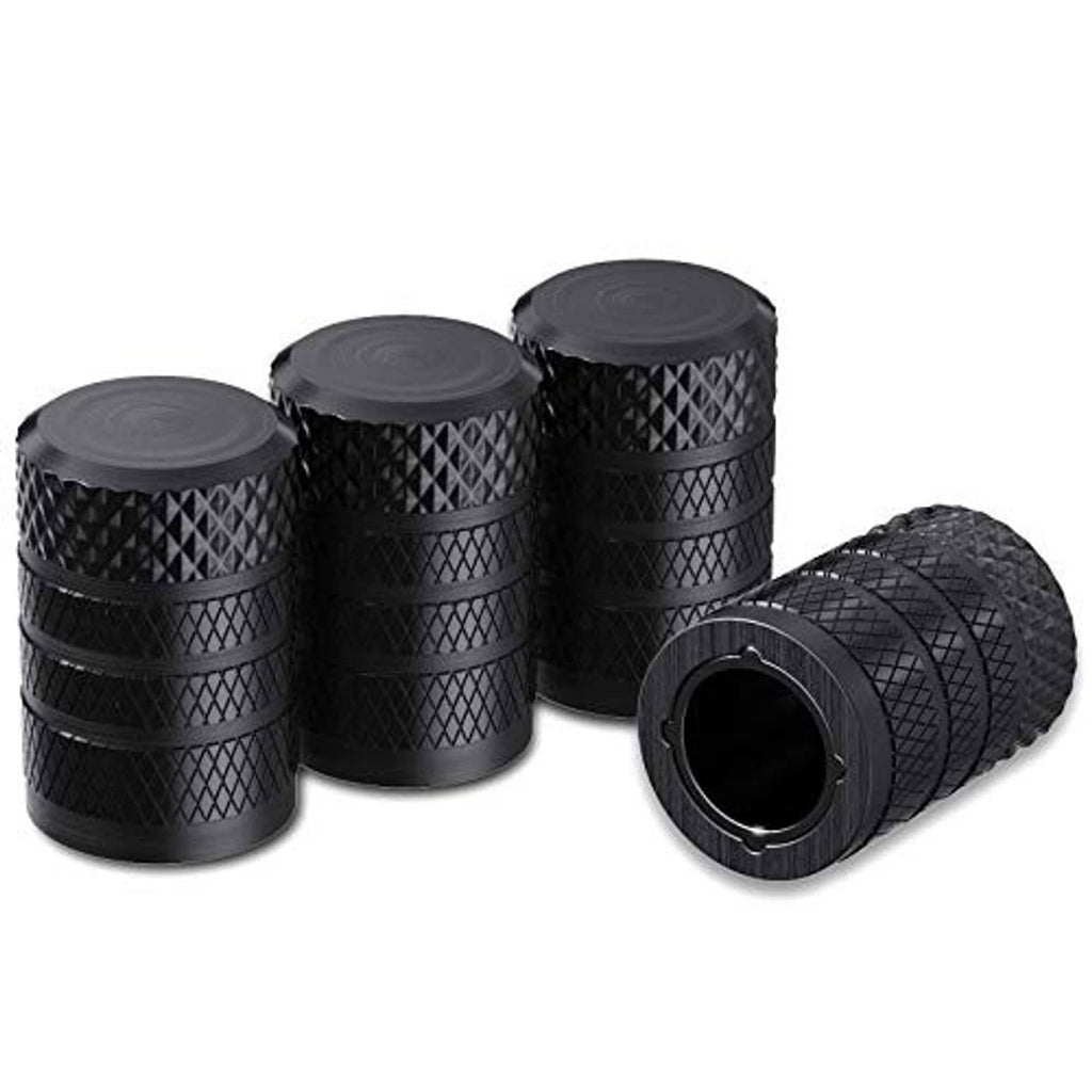 Set of four black anodized aluminum tire valve stem caps with textured diamond pattern