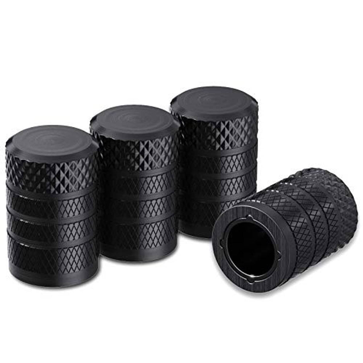 Set of four black anodized aluminum tire valve stem caps with textured diamond pattern