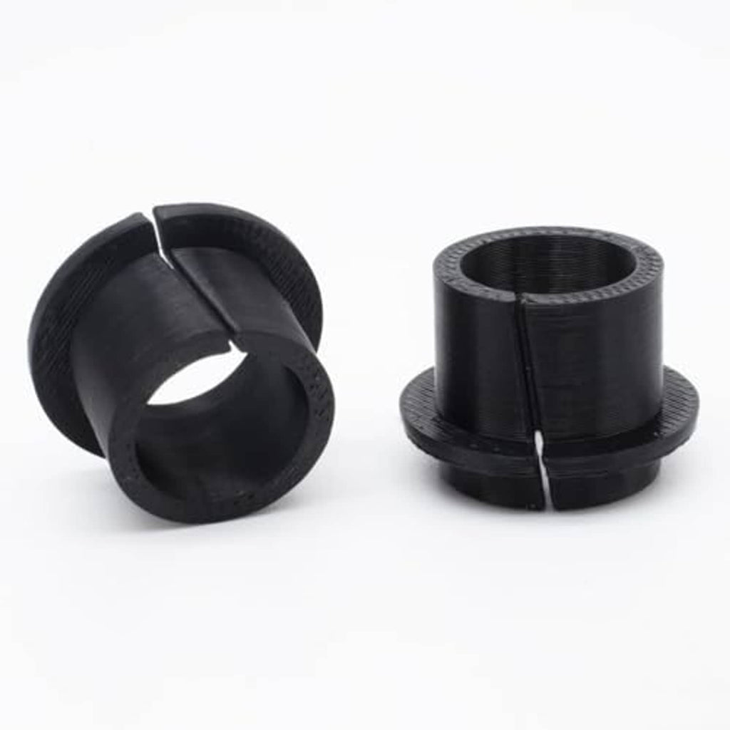 Manual transmission shift cable bushing kit, two black cylindrical rubber bushings
