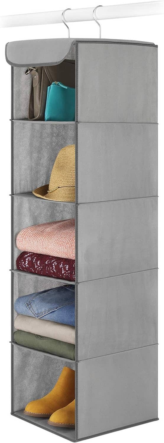 Gray hanging closet organizer with metal frame, multiple open compartments with folded items