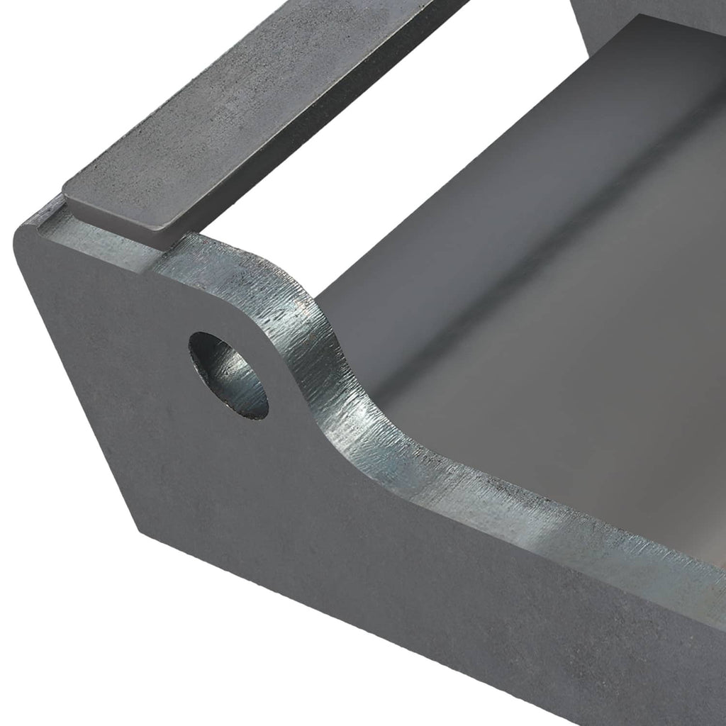 Close-up excavator coupler bracket section with circular hole and dark gray steel wear surface